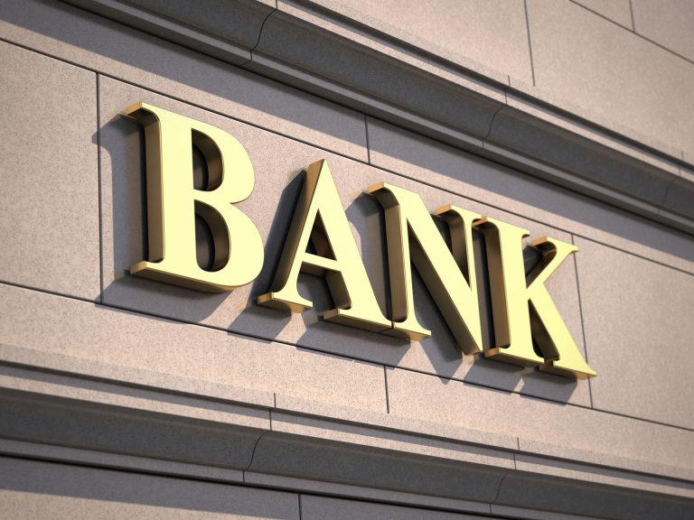 a bank sign on the side of a building.
